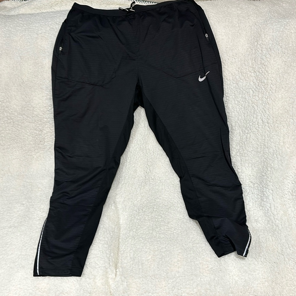 Nike running pants. Never worn. Black in color
